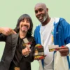 Image of CEO Josh Kesselman and NBA All Star Gary Payton holding Gary's signature RAW Rolling papers