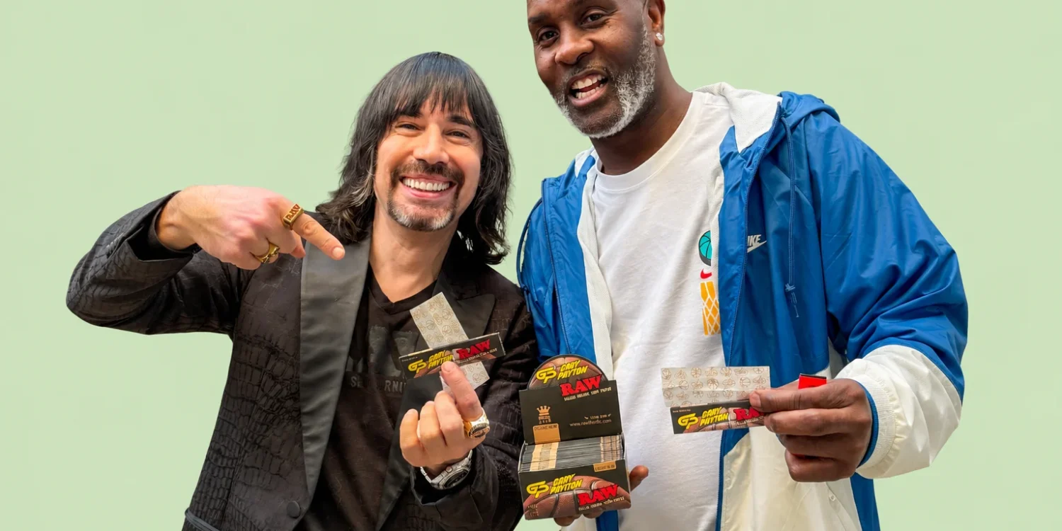 Image of CEO Josh Kesselman and NBA All Star Gary Payton holding Gary's signature RAW Rolling papers