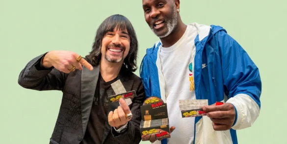 Image of CEO Josh Kesselman and NBA All Star Gary Payton holding Gary's signature RAW Rolling papers
