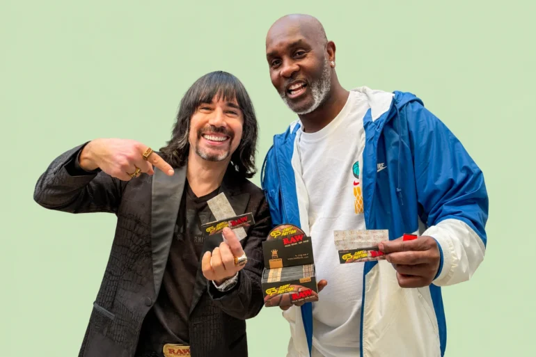 Image of CEO Josh Kesselman and NBA All Star Gary Payton holding Gary's signature RAW Rolling papers