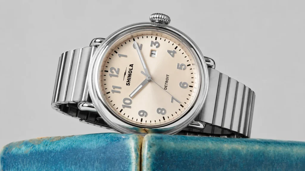 The cream-dial Shinola Detrola pairs a softer, vintage-inspired face with a polished steel bracelet for a cleaner everyday look.