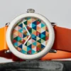 Shinola’s Detrola Art Dial brings the collection’s playful side forward with a bold geometric face and bright orange strap.