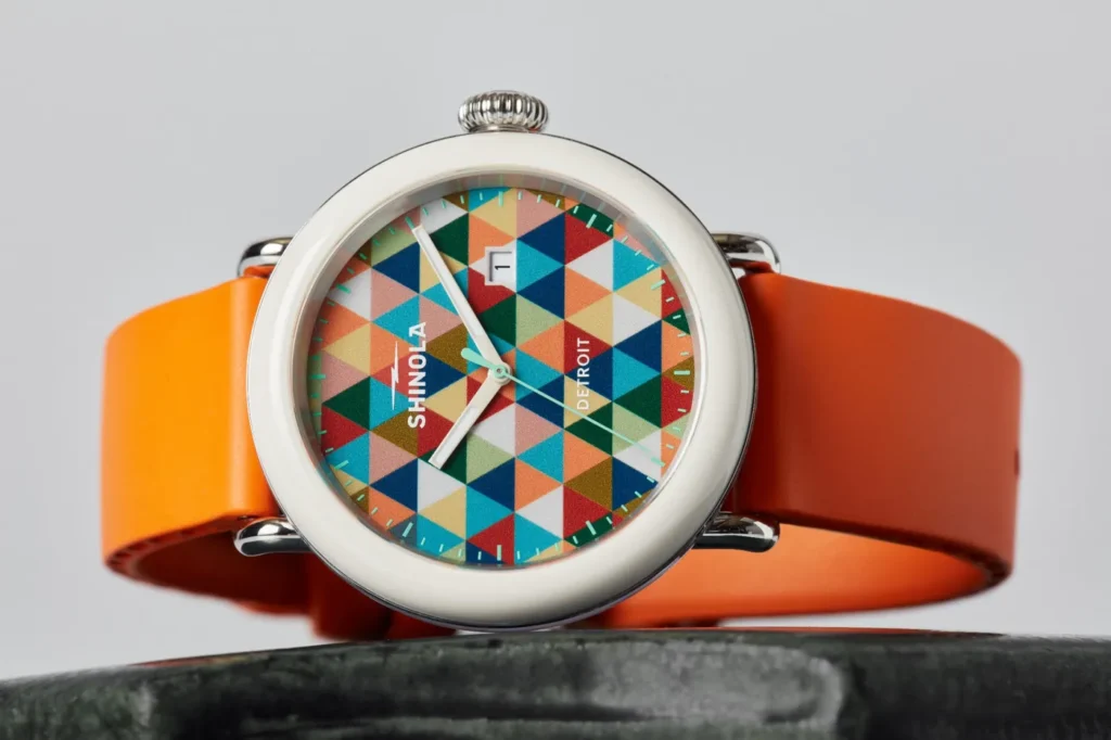 Shinola’s Detrola Art Dial brings the collection’s playful side forward with a bold geometric face and bright orange strap.