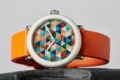 Shinola’s Detrola Art Dial brings the collection’s playful side forward with a bold geometric face and bright orange strap.