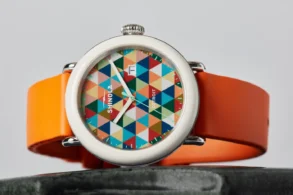 Shinola’s Detrola Art Dial brings the collection’s playful side forward with a bold geometric face and bright orange strap.